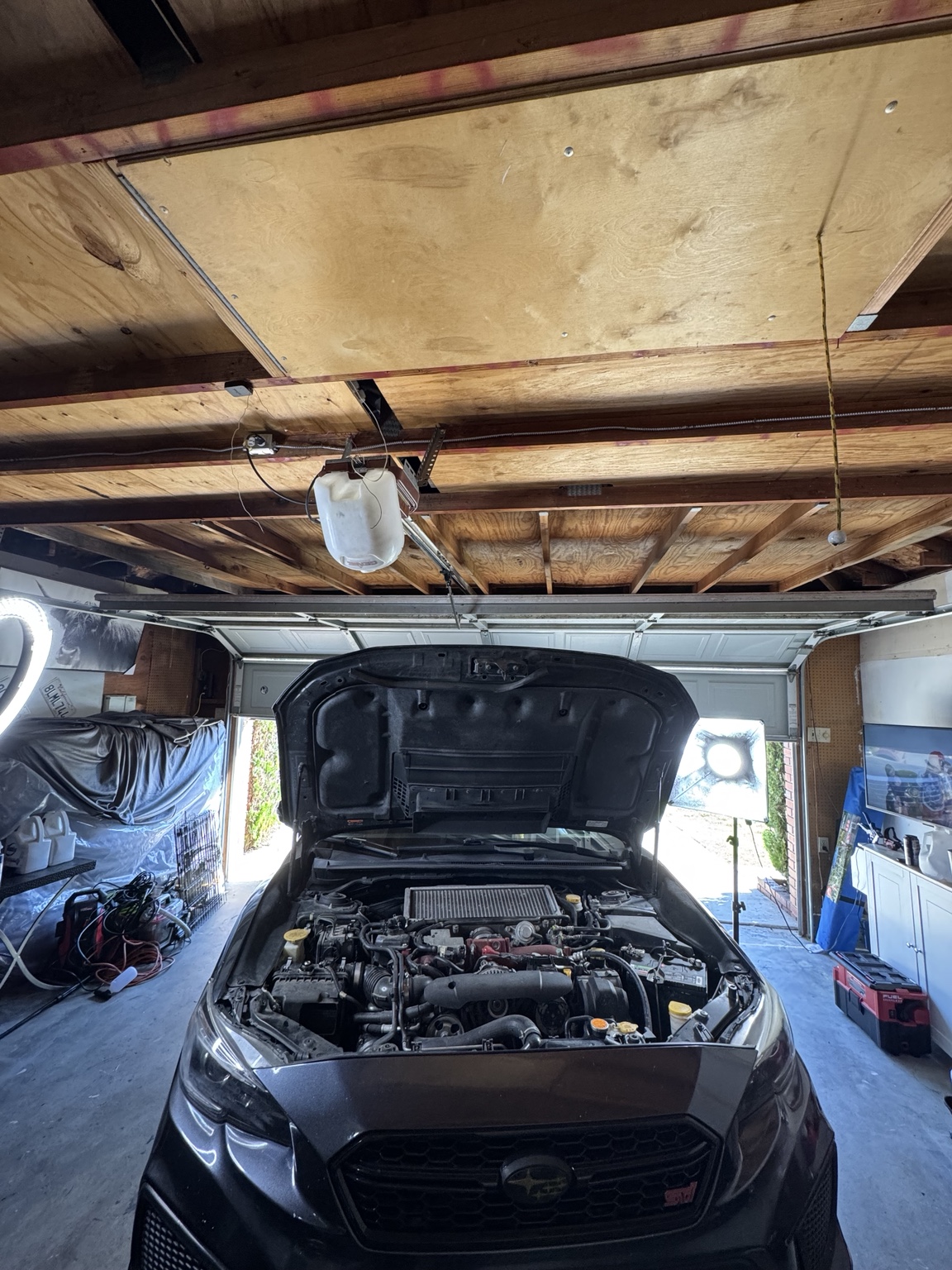 Subaru STI in a garage for service