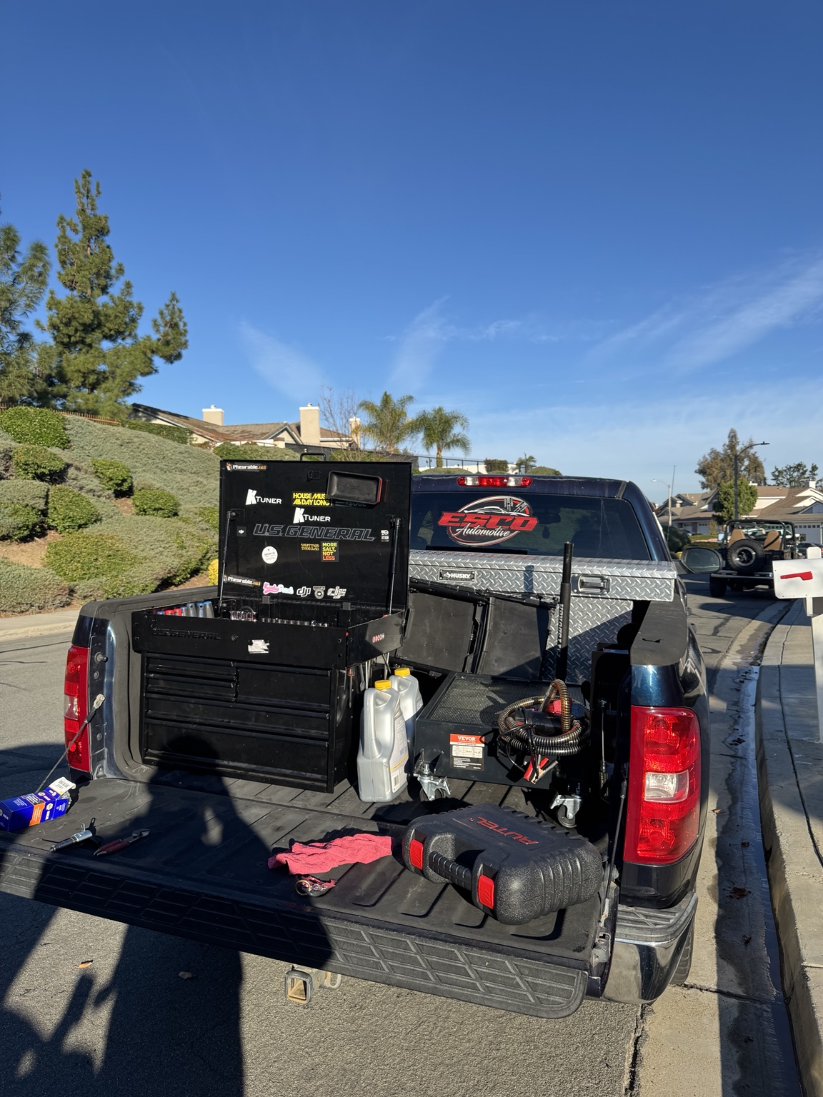 Esco Auto truck bed setup with tools and equipment